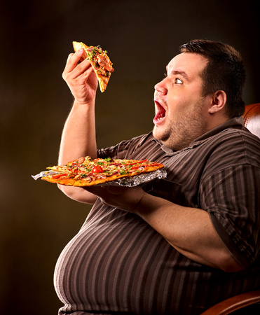 82424223-diet-failure-of-fat-man-eating-fast-food-slice-pizza-on-plate-close-up-of-breakfast-for-hungry.jpg